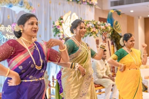 Baby shower photographer pune — gift unwrapping moment by Nestled Photography Baner