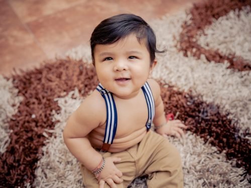 Creative baby photoshoot with unique props at our Pune studio
