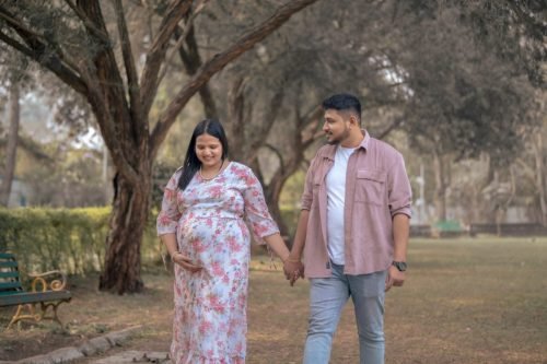 Premium maternity photoshoot in Pune at luxury studio.