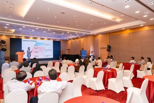 Conference photographer in Mumbai covering a discussion session at Radisson