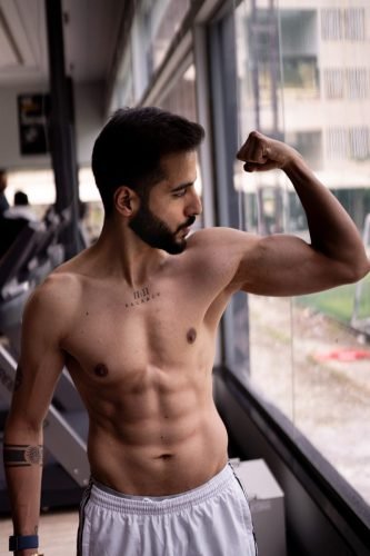 Male model gym portfolio by expert photographer in Pune.