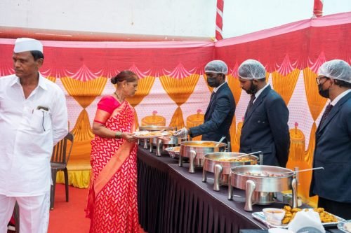 House warming ceremony photoshoot — pandit performing pooja by Nestled Photography Baner