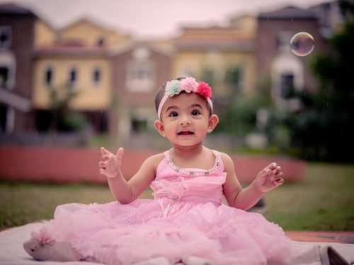 Themed baby girl photoshoot in Baner Pune — creative props and magical setup